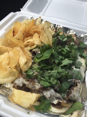 Today's Lunch Special to-go... Basil Bistecca Sandwich (onion, mushroom, steak, basil) with chips! Delicious!