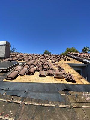 Tile Removal / demolition to install composition shingles.