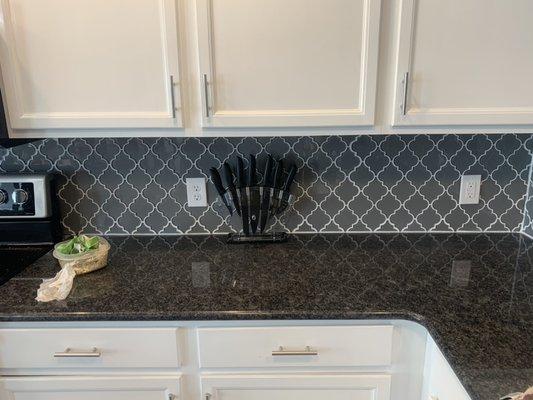 Completed backsplash on new countertops and cabinets