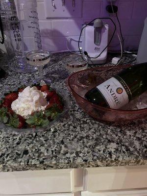 Date night includes champagne, strawberries and whipped cream.