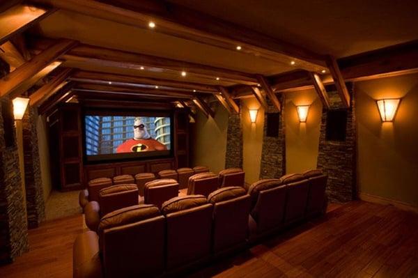 Home Theater Layout with Custom Seating, Sony Projection, and a custom rack of theatre gear controlled by Crestron.