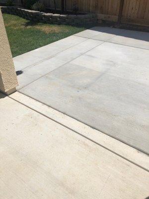 Square rust stain from dunk tank. We already used a pressure washer and tried to scrub this off. This concrete is only a few months old.