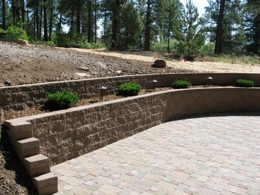 Terraced retaining wall concrete paver patio