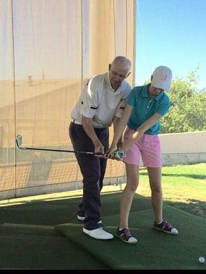 George working with an AJGA player.