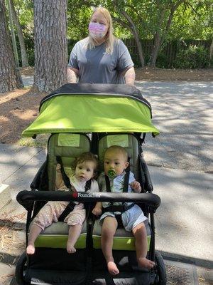 Ms. Nikki takes the Pink Room babies out for a neighborhood stroll.