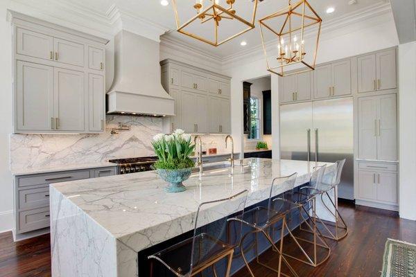 Beautiful Kitchen Marble Work , Custom Waterfall Island , High Back Splash and Counter Tops .