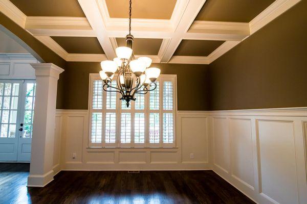 Recessed style wainscoting and coffered ceiling.