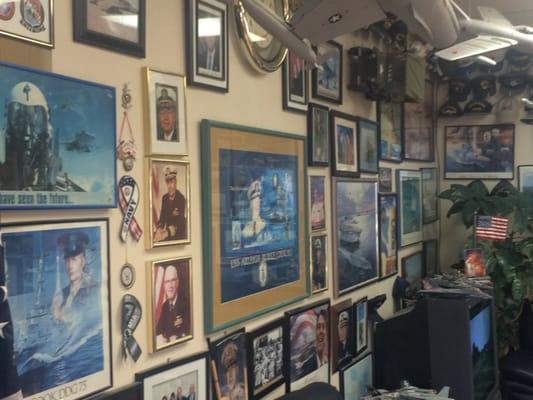 Walls adorned with military stuff, Andy was USN