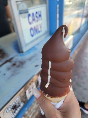 Chocolate dipped ice cream cone.