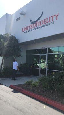 Ceasar (Branch Manager) seeing the sign for the very first time after it just went up.