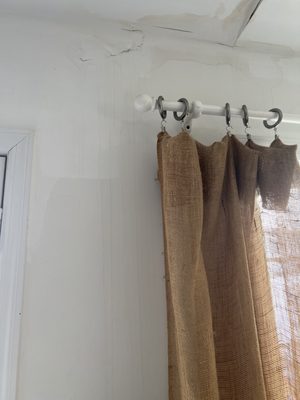 Water damaged ceiling/wall from solar panel install