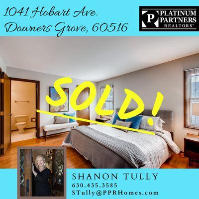 Happy clients completing a successful  sale of their staged home in Downers Grove!