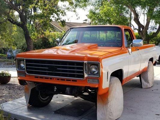 Our dump run truck, Ford ceramic white pearl and a straight up PPG orange toner created by Meza Paint.