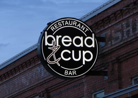 Bread and Cup Restaurant and Bar.  Projection sign.  Aluminum faces with routed out copy, backed w/ acrylic.