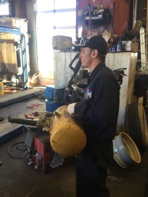 General Service Technician getting ready to mount up a difficult tire job.