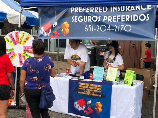 Andrew & Camila in the Preferred Insurance - Seguros Preferidos' booth at Fiesta Latina 2019