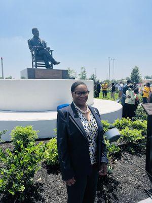 Standing in front of the Booker T. Washington Statue Sculptor by Bridgette Mongeon.