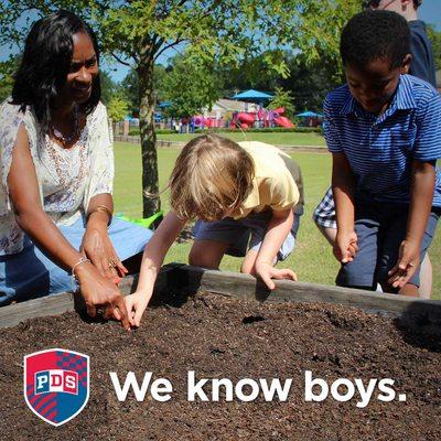 Boys aren't afraid to get their hands dirty while learning!