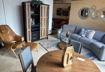 Palliser curved sofa with Fjords mid-century modern chair, and Amisco dining table set...along with Universal bar cabinet.