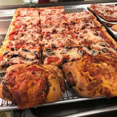 Homemade pizza and sausage horns