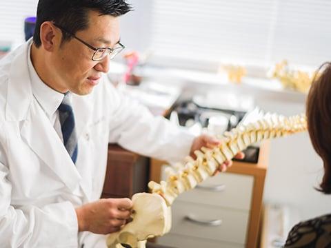 Dr. Lim explains spinal condition to patient