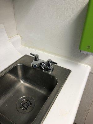 Replaced kitchen sink faucet in a schools kitchen