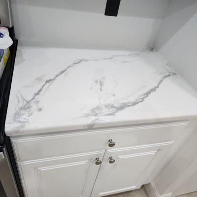 Cabinets and countertops after refinishing project.