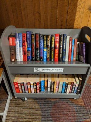 Free little library inside, in seating area