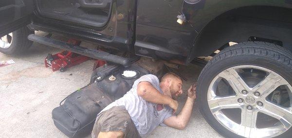 Paul dropping a fuel tank on a 2011 Dodge Ram for a Fuel pump replacement