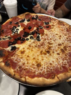 Half cheese, half pepperoni and olives