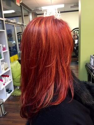 Beautiful bright red with apricot highlights! Also soft movement in a layered cut