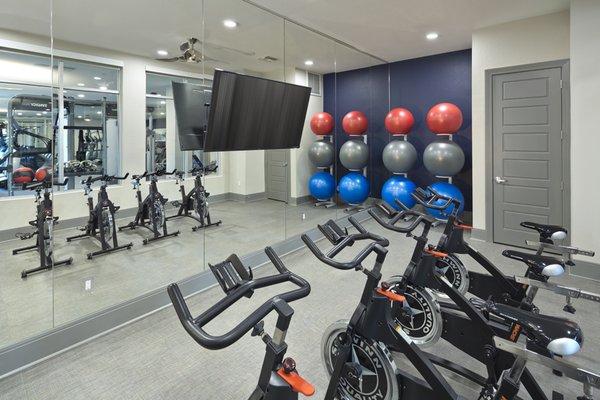 Fitness studio with virtual trainer and spin bikes