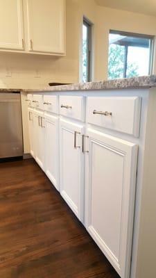 The after picture.Kitchen remodeling.Kitchen Cabinets painting. Granite installation.Backslash installation.Cabinet doors nobs.