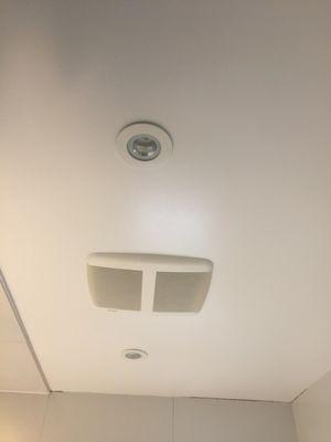 Bathroom lighting with speakers built in fan