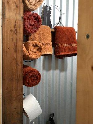 Barbed wire stitched towels in The Rancher bath