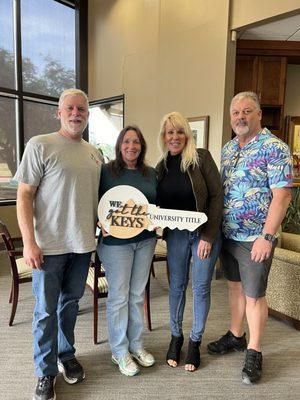 With Cyndy and Scott just after final closing on our new home.