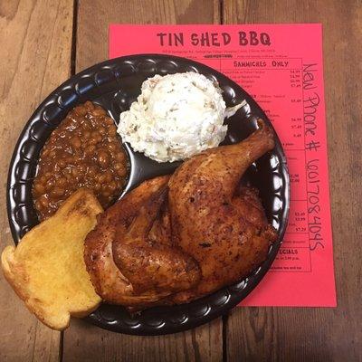 Juicy smoked half chicken with baked beans and loaded potato salad