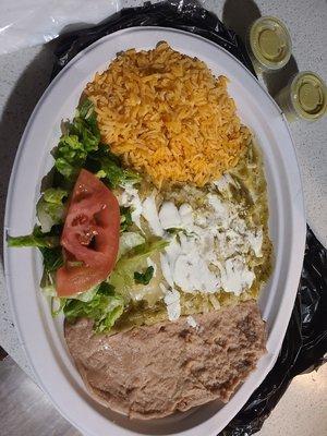 Cheese enchilada plate with refried beans, rice, and salad.