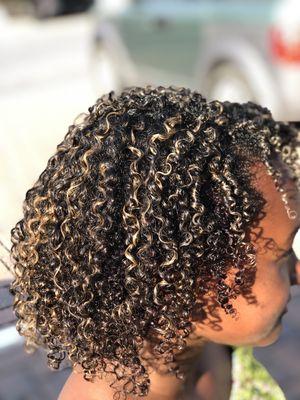 Blond highlights on naturally curly hair