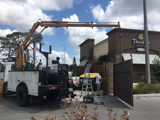 Hanging 1000pound gates destroyed by hurricane Irma.