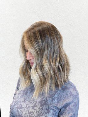 A lived-in blonde balayage with bright face framing, giving an effortless look with a beautiful growout by Kerri Underwood and Alaina Ramsay