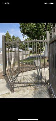 Heavily damaged metal gate.