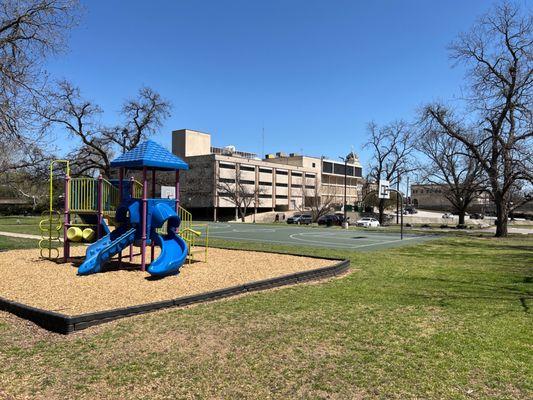 Small playground area with basketball court