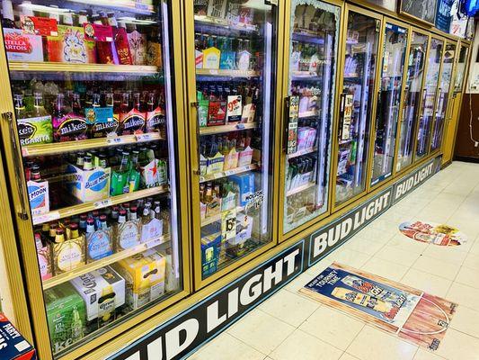 Cold selection of beer (lager, IPA, ale, porter, stout), cider, hard seltzer, and wine