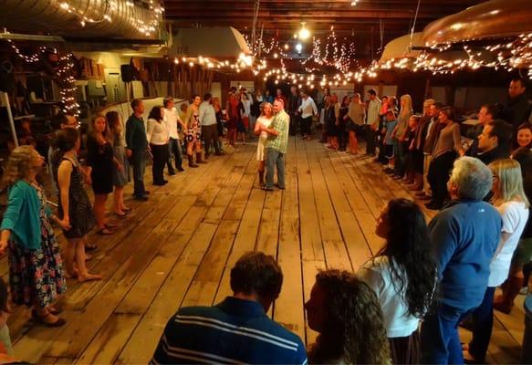 A wedding dance inside the Cama Beach State Park boathouse