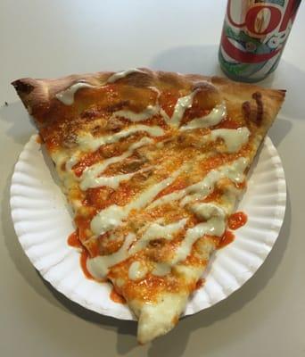 Buffalo chicken pizza slice with blue cheese sauce