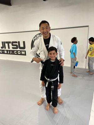 Second stripe promotion on his grey and white belt