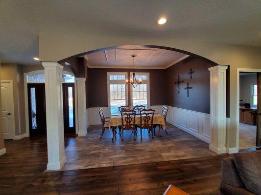 Custom built columns, crown molding, chair rail and arched openings make this formal dining room a stunner!