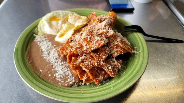 Chilaquiles Rojos with over medium egg.