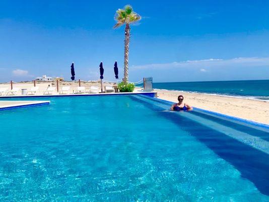 Infinity pool with an ocean view. Right next to the lazy river pool.